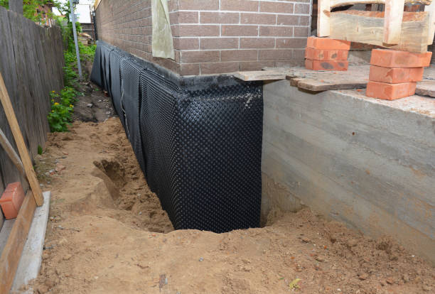 Happy homeowners after waterproofing job in Henrietta